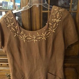 Brown dress size 14 with cute pattern of beads on the neck and at the bottom